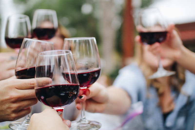 Hand holding wine glass